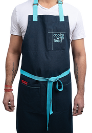 The Christine Cushing Adult Apron - Provides 100 Meals