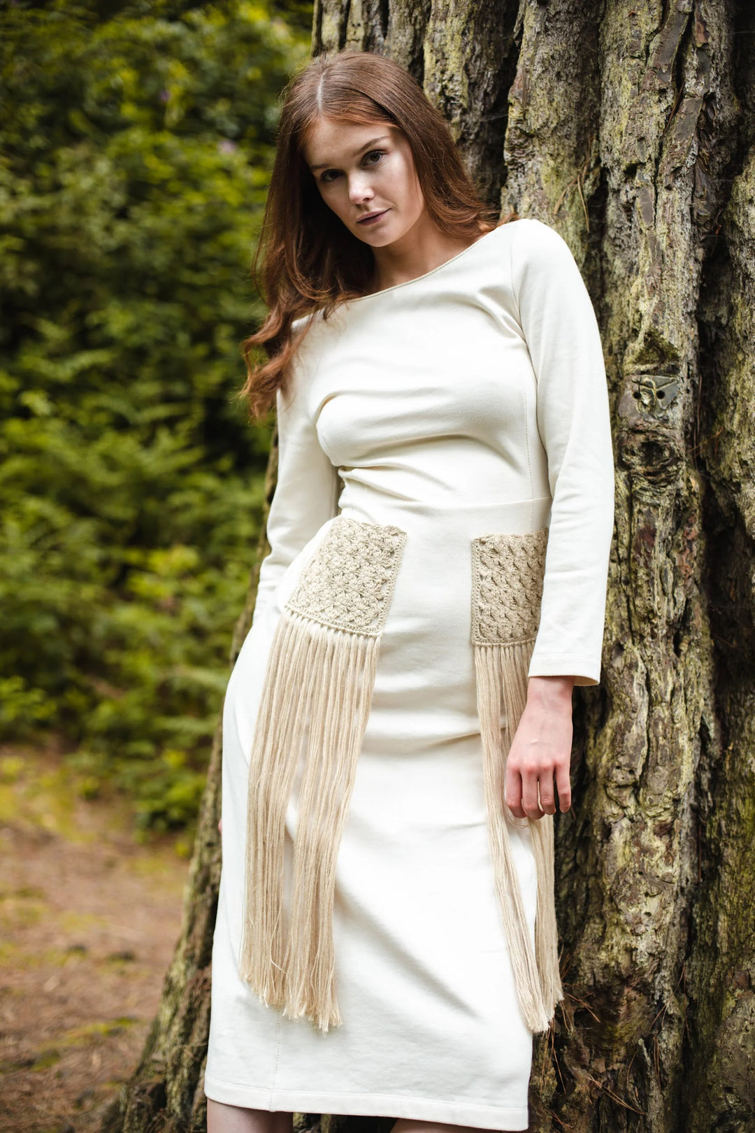 Organic dress with hand knitted pockets and fringing