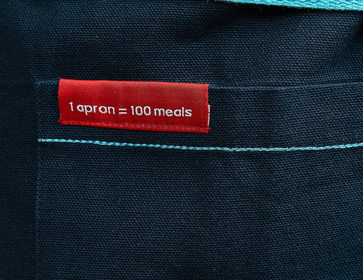 The Christine Cushing Adult Apron - Provides 100 Meals