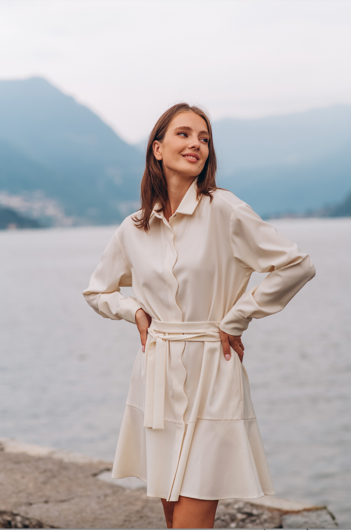 White wool shirt dress with wave-shaped placket